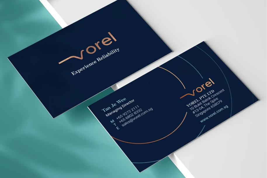 Dark blue business card with the Vorel logo and the tagline “Experience Reliability.”