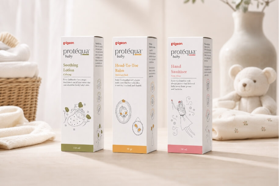 Three Protèqua baby care boxes displayed on a light wooden surface: Soothing Lotion, Head-To-Toe Balm, and Hand Sanitiser.