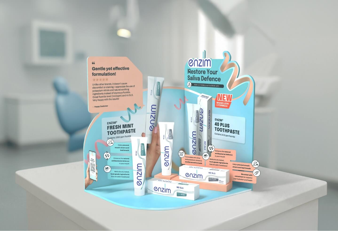 Promotional display of Enzim toothpaste with mint flavor packages and posters on a light blue stand.
