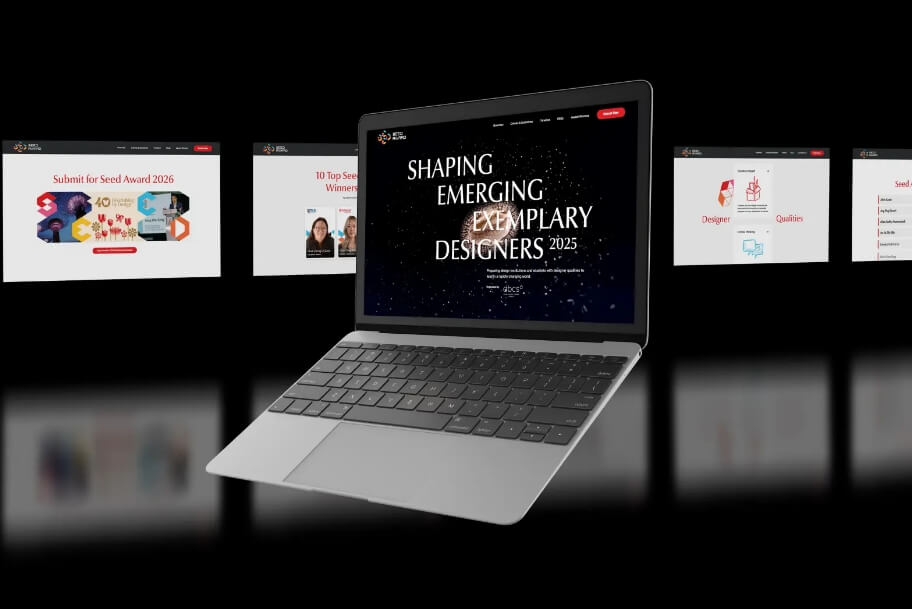 Floating silver laptop on a dark background showing a banner reading 'Shaping Emerging Exemplary Designers 2025' with blurred slides in the background.